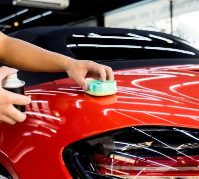 bigstock-Car-Service-Worker-Applying-Na-375974350